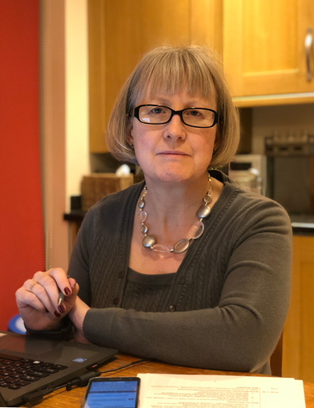 Faith Spear at desk colour 450px